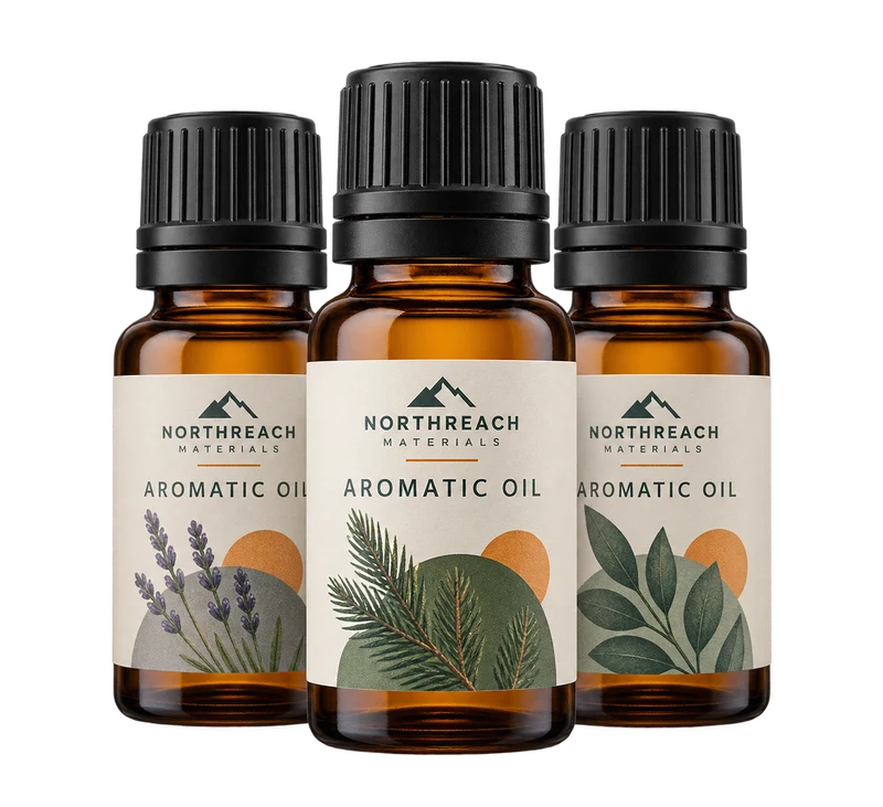 Three small amber essential-oil bottles with black screw caps, with fictional NORTHREACH MATERIALS branding.